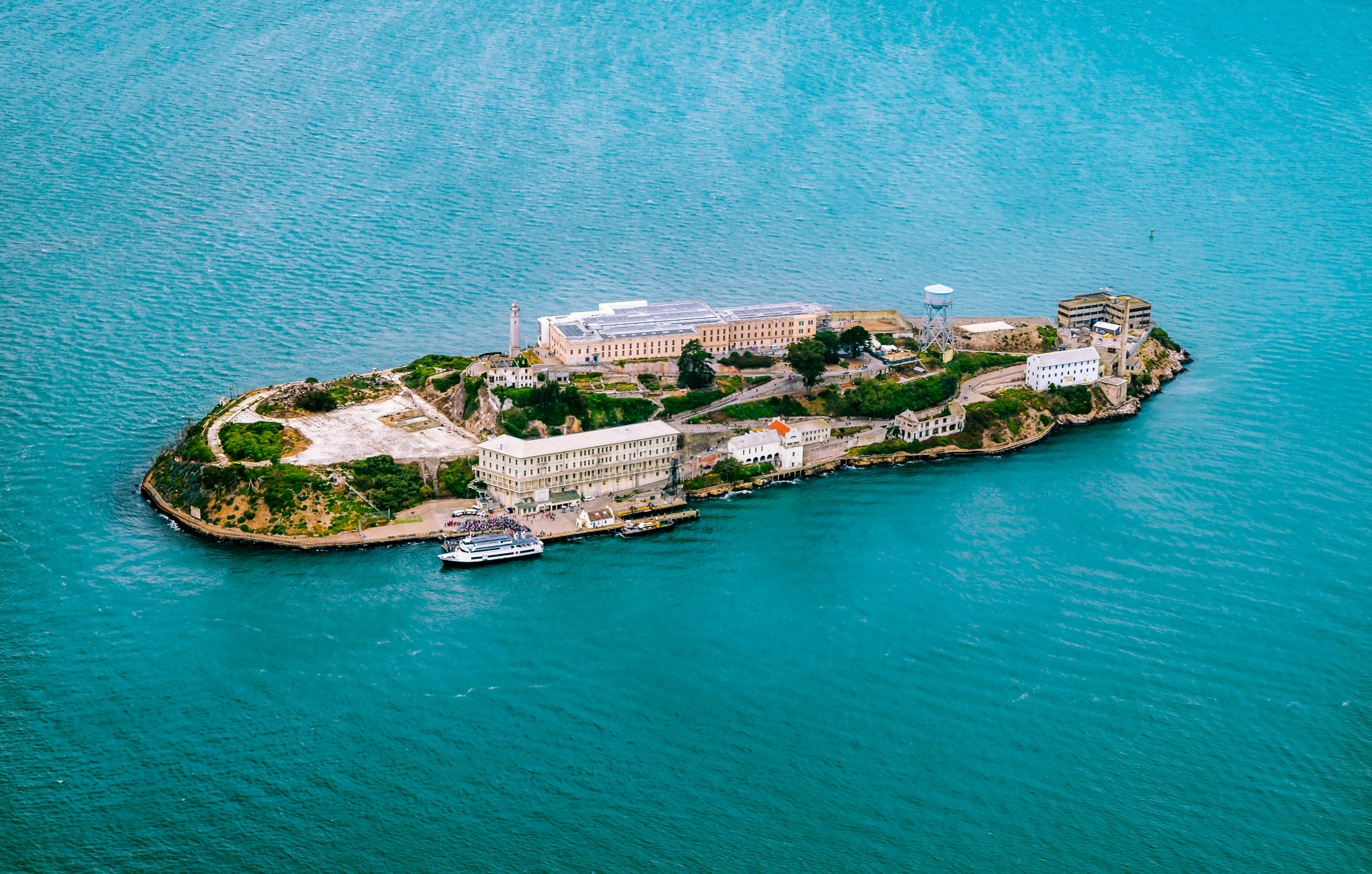 top view photography of island surrounded by body of water